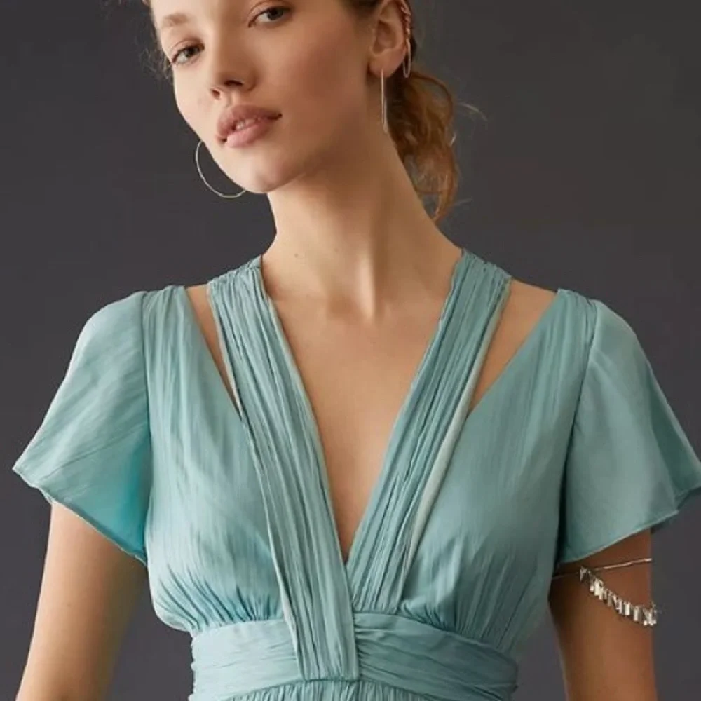 Anthropologie Deep V-Neck Vibrant Mini Dress
By Anthropologie_6